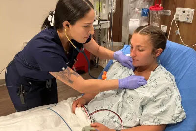 Christina Vega, RN, a recent graduate of the Lake Sumter State Dedicated Education Unit at AdventHealth Waterman treats a patient in the emergency department.