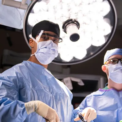 Two surgeons in the middle of a surgery
