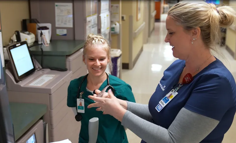 A preceptor nurse at AdventHealth Palm Coast mentors a student-nurse from Jacksonville University.